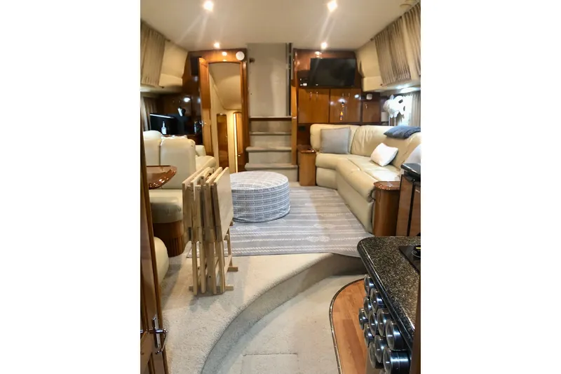 Slide: The Image of Luxurious interior of 2005 Carver 444 Cockpit Motor Yacht with elegant seating and modern amenities. - 49