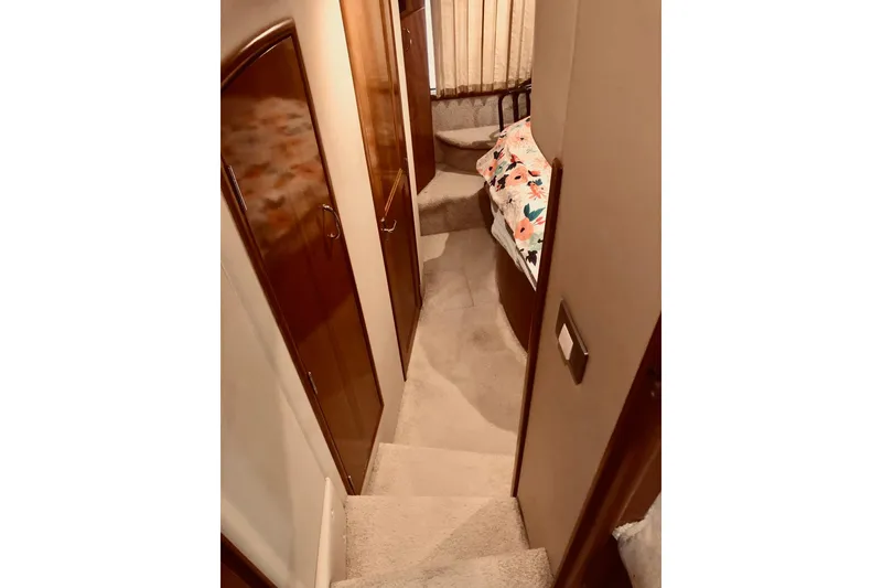 Slide: The Image of Interior of 2005 Carver 444 Cockpit Motor Yacht with carpeted stairs and cozy cabin. - 65