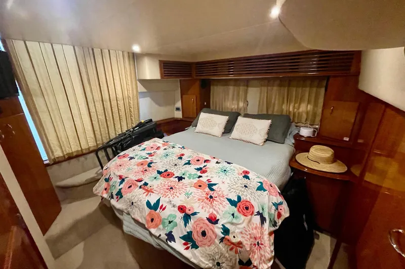 Slide: The Image of Luxurious bedroom interior of 2005 Carver 444 Cockpit Motor Yacht with floral bedding. - 66