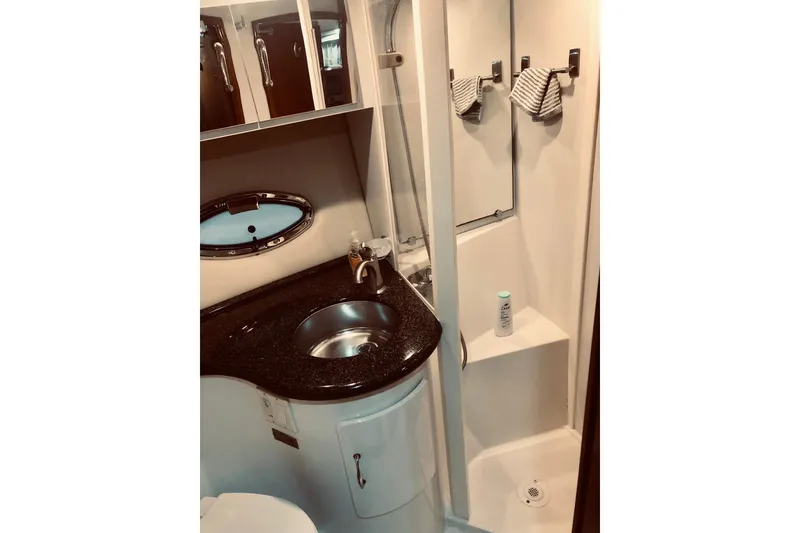 Slide: The Image of Bathroom interior of 2005 Carver 444 Cockpit Motor Yacht with sink and shower. - 74