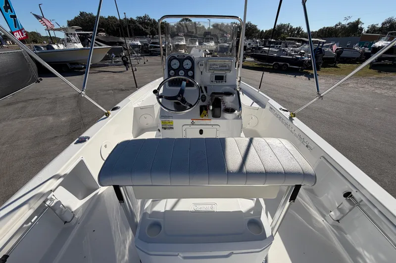 Slide: The Image of 2013 Sea Hunt XP 19 boat interior with steering console and seating. - 17