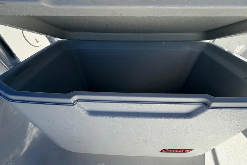 Slide: The Image of Open Coleman cooler on 2013 Sea Hunt XP 19 boat deck. - 19