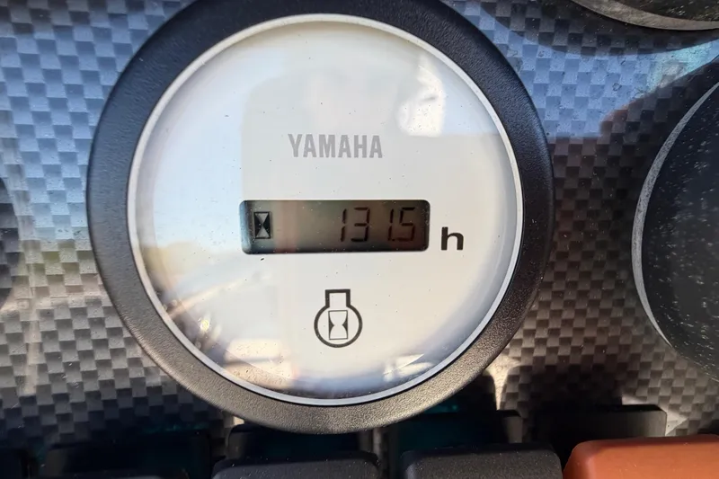 Slide: The Image of Yamaha hour meter showing 1315 hours on 2013 Sea Hunt XP 19 boat. - 24