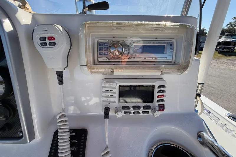 Slide: The Image of 2013 Sea Hunt XP 19 boat console with radio and GPS equipment. - 25