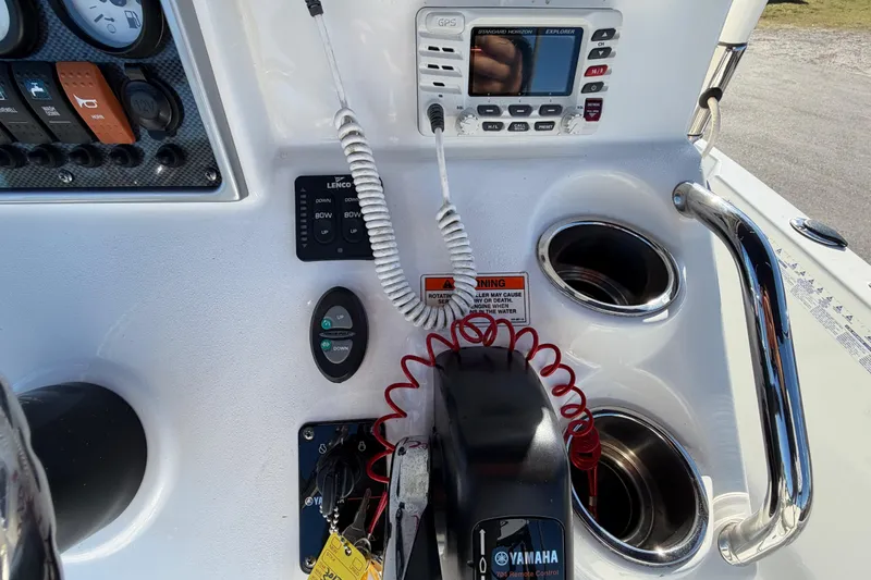 Slide: The Image of Control panel of a 2013 Sea Hunt XP 19 boat with GPS and Yamaha controls. - 26