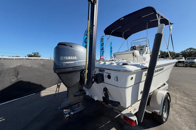 Slide: The Image of 2013 Sea Hunt XP 19 boat with Yamaha outboard motor on trailer. - 3