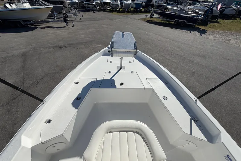 Slide: The Image of 2013 Sea Hunt XP 19 boat interior, featuring spacious seating and storage compartments. - 31