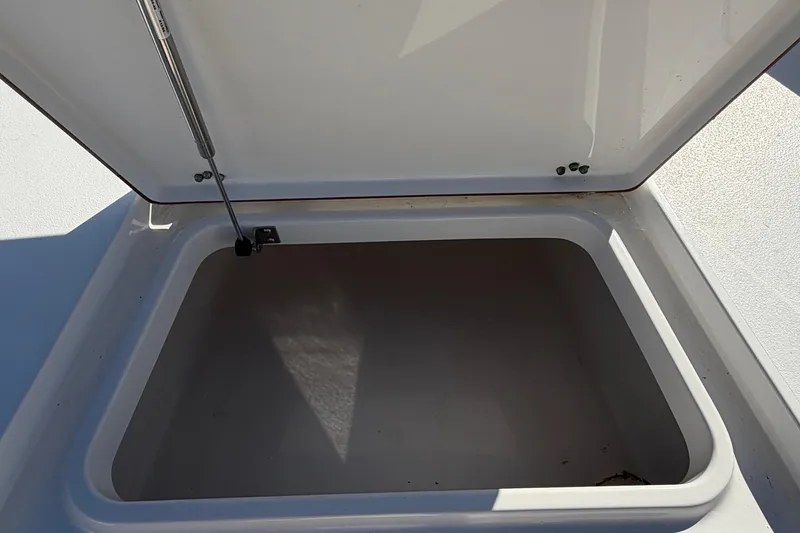 Slide: The Image of Open storage compartment on 2013 Sea Hunt XP 19 boat. - 36