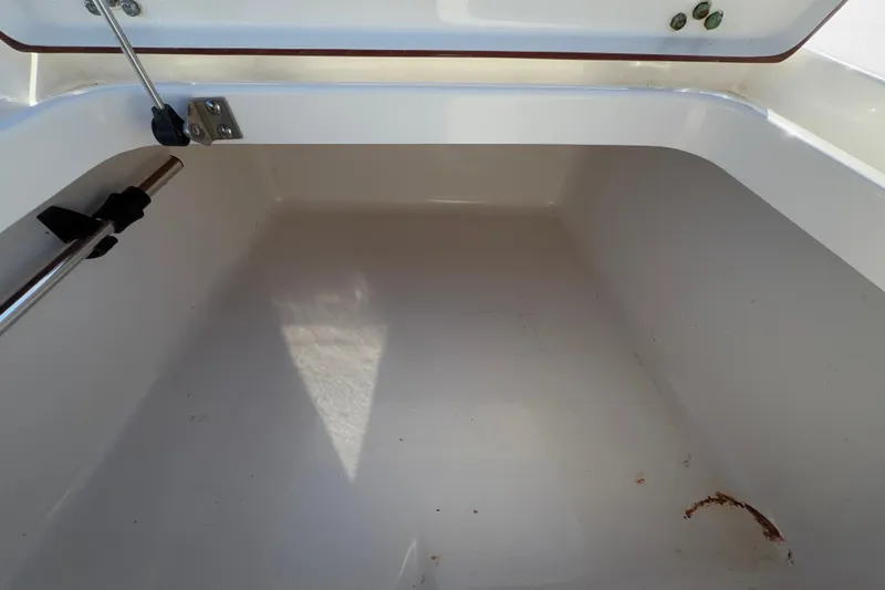 Slide: The Image of Open storage compartment in 2013 Sea Hunt XP 19 boat. - 37