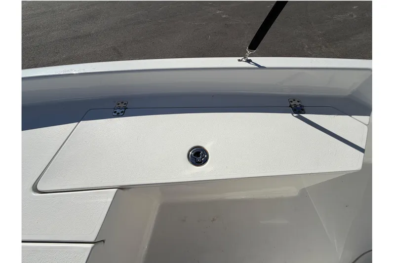 Slide: The Image of 2013 Sea Hunt XP 19 boat storage compartment with secure latch and hinges. - 38