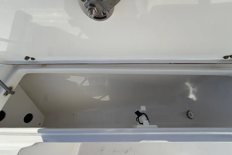 Slide: The Image of Open storage compartment on a 2013 Sea Hunt XP 19 boat. - 39