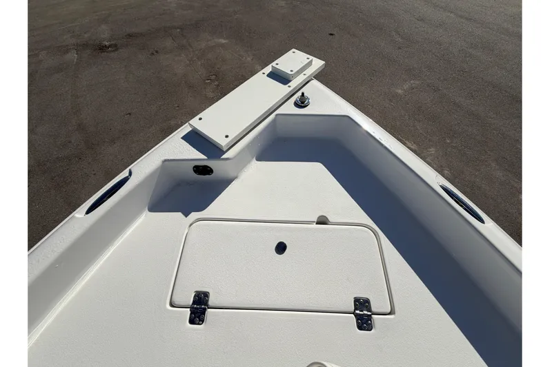 Slide: The Image of Bow of 2013 Sea Hunt XP 19 boat with storage compartment and clean deck design. - 40