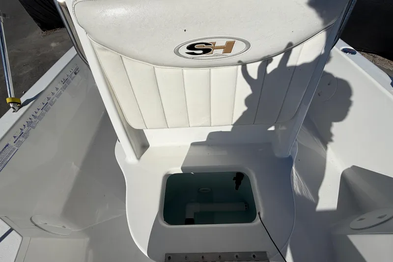 Slide: The Image of 2013 Sea Hunt XP 19 boat interior with seating and storage compartment. - 51
