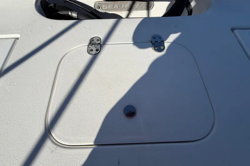 Slide: The Image of 2013 Sea Hunt XP 19 boat deck with hatch and shadow. - 58