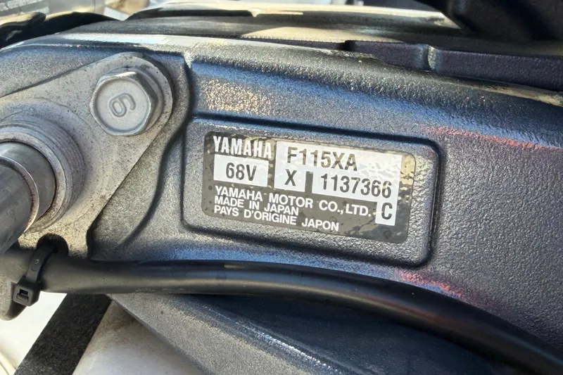 Slide: The Image of Yamaha F115XA engine label on 2013 Sea Hunt XP 19 boat, made in Japan. - 64