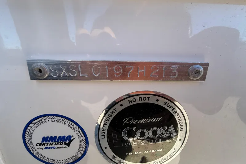 Slide: The Image of 2013 Sea Hunt XP 19 boat with serial number and certification labels. - 65