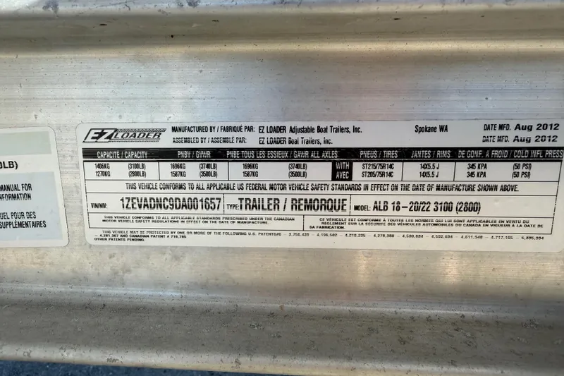 Slide: The Image of Label on EZ Loader trailer, manufactured August 2012, showing capacity and specifications. - 66