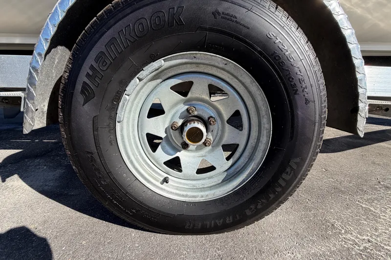 Slide: The Image of Close-up of a Hankook tire on a 2013 Sea Hunt XP 19 trailer. - 67