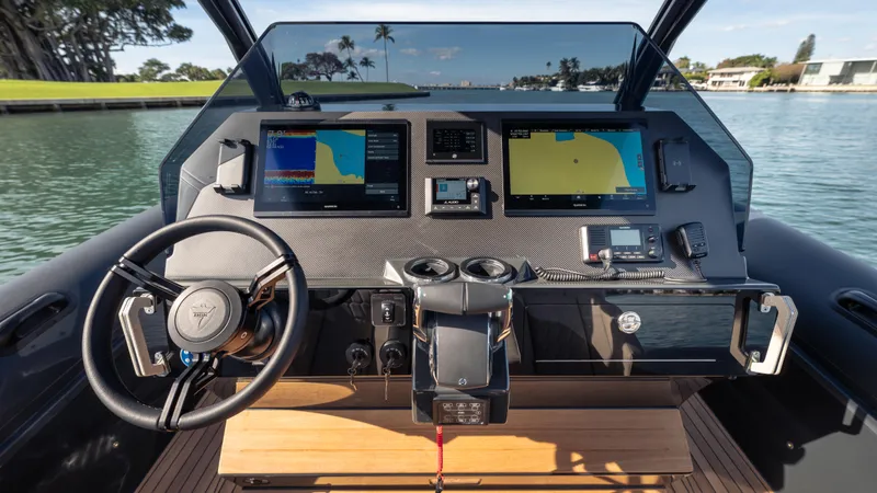 Slide: The Image of Helm of 2024 Skipper-BSK 38 boat with advanced navigation displays and controls. - 14