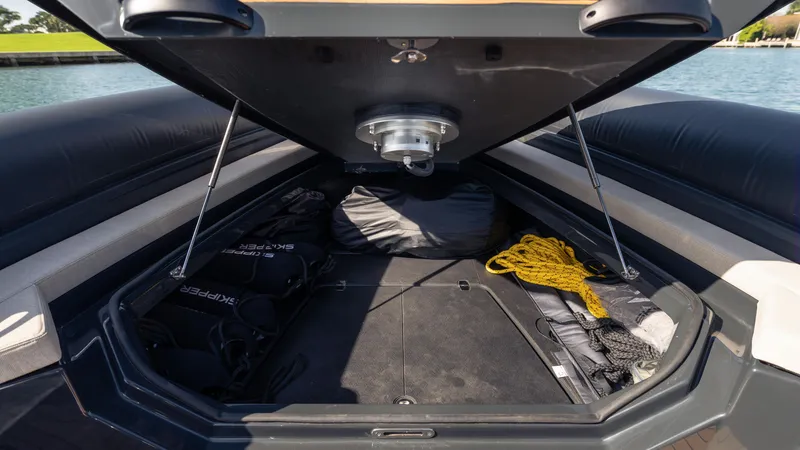Slide: The Image of Open storage compartment on 2024 Skipper-BSK 38 boat, featuring ropes and equipment. - 28
