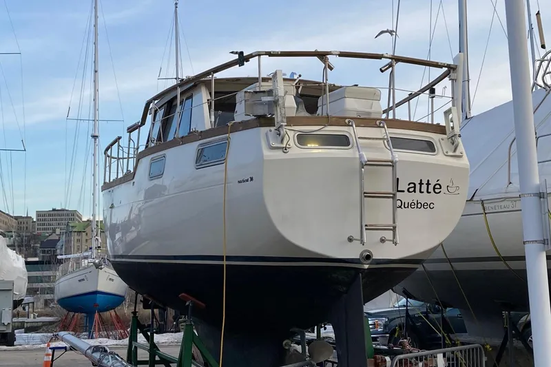 Slide: The Image of 1987 Nauticat 38 sailboat named Latté, docked in Québec marina. - 10