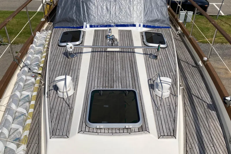 Slide: The Image of Deck of 1987 Nauticat 38 sailboat with wooden finish and hatches. - 15