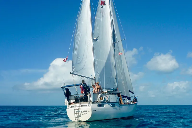 Slide: The Image of Sailing yacht Nauticat 38, 1987 model, cruising on open sea under clear blue sky. - 2