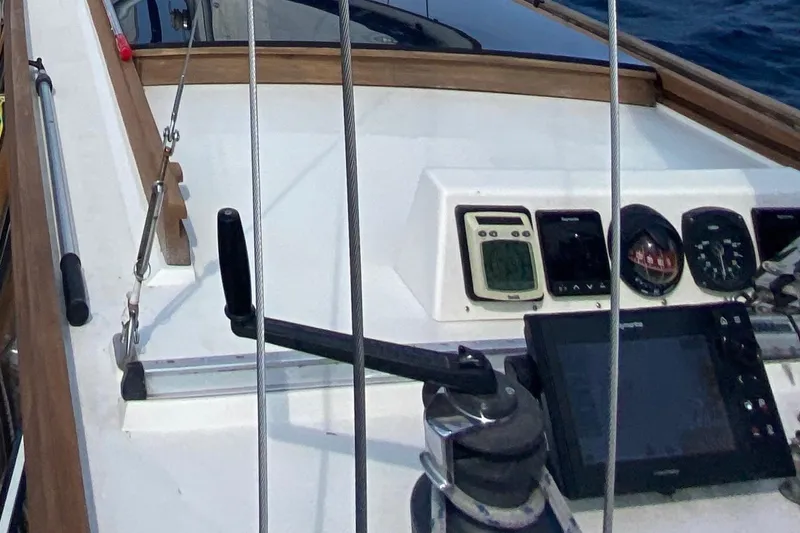 Slide: The Image of Cockpit of 1987 Nauticat 38 sailboat with navigation instruments and controls. - 21