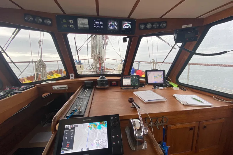 Slide: The Image of Interior view of 1987 Nauticat 38 sailboat cockpit with navigation equipment. - 29
