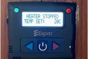 Slide: The Image of Espar heater control panel displaying "Heater Stopped" and "Temp Set: 20°C" on a Nauticat 38, 1987. - 31