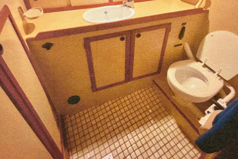 Slide: The Image of Bathroom interior of 1987 Nauticat 38 sailboat with sink and toilet. - 46