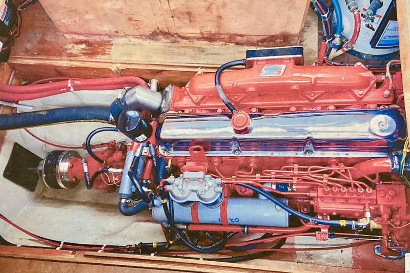 Slide: The Image of Engine compartment of a 1987 Nauticat 38 sailboat, showcasing detailed mechanical components. - 48