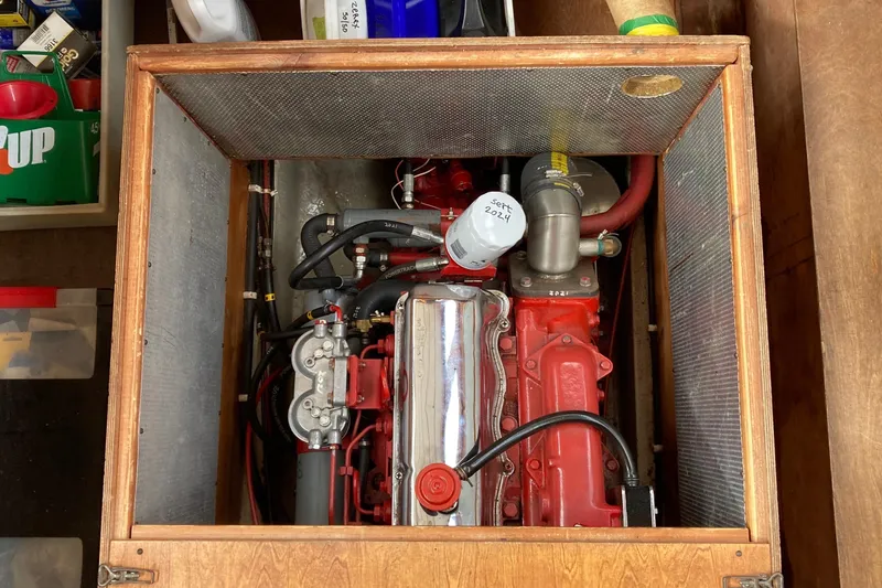 Slide: The Image of Engine compartment of a 1987 Nauticat 38 sailboat, showcasing a well-maintained marine engine. - 49