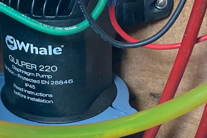 Slide: The Image of Whale Gulper 220 diaphragm pump in Nauticat 38, 1987 model, with colorful wiring. - 54