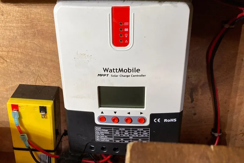 Slide: The Image of MPPT solar charge controller in 1987 Nauticat 38 boat, with wiring and display. - 56