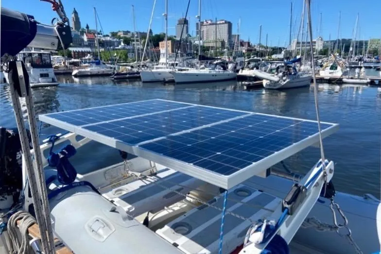Slide: The Image of 1987 Nauticat 38 sailboat with solar panels docked in a marina. - 57