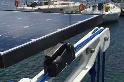 Slide: The Image of Solar panel on 1987 Nauticat 38 sailboat with blue rope and cleat, docked at marina. - 58