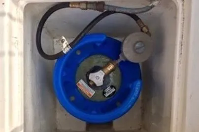 Slide: The Image of Blue propane tank in a 1987 Nauticat 38 boat compartment. - 60