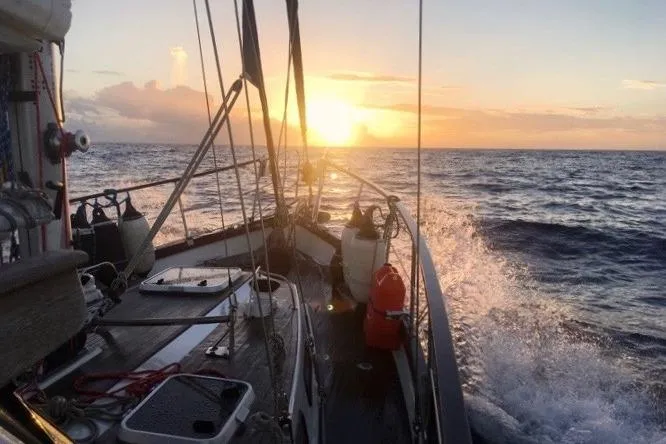 Slide: The Image of Sailing Nauticat 38 yacht at sunset, 1987 model, ocean waves splashing. - 62