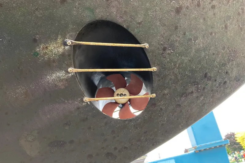 Slide: The Image of Bow thruster of a 1987 Nauticat 38 sailboat, featuring protective bars. - 7