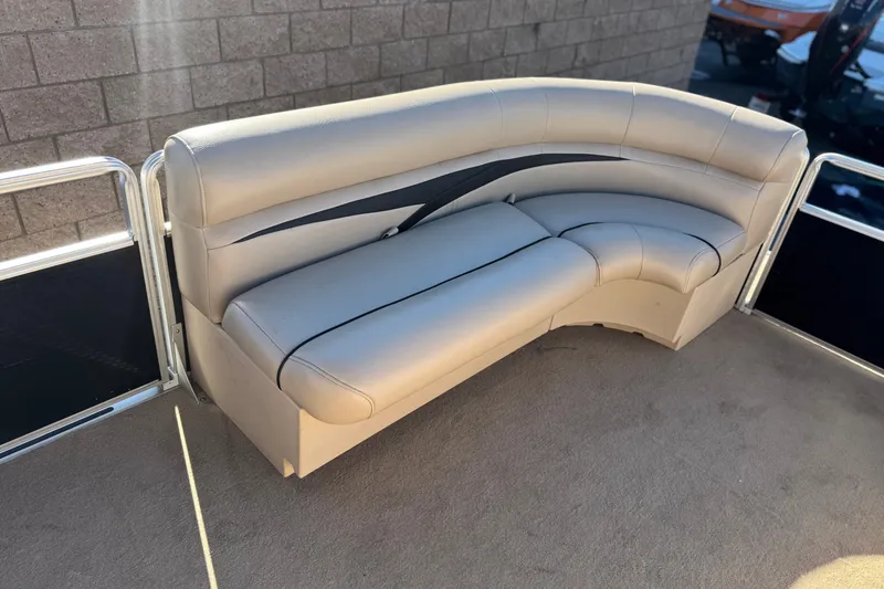 Slide: The Image of 2011 Harris Cruiser 220 CX boat seating with beige upholstery and sleek design. - 11