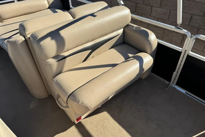 Slide: The Image of 2011 Harris Cruiser 220 CX boat interior with beige seating and metal railing. - 15