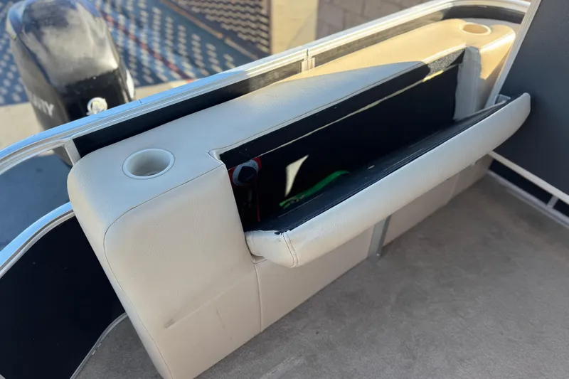 Slide: The Image of 2011 Harris Cruiser 220 CX boat seat with storage compartment and cup holder. - 19