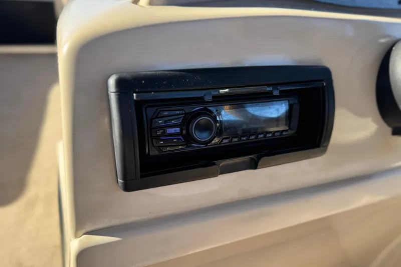 Slide: The Image of Dashboard stereo system on 2011 Harris Cruiser 220 CX boat. - 24