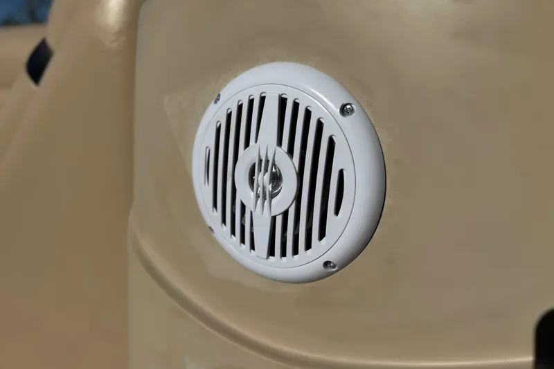 Slide: The Image of White speaker on 2011 Harris Cruiser 220 CX boat's beige surface. - 25