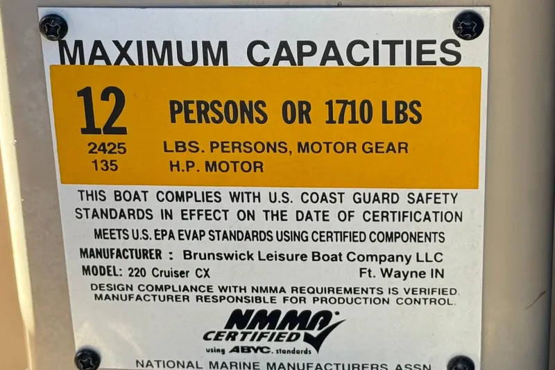 Slide: The Image of 2011 Harris Cruiser 220 CX capacity label, 12 persons or 1710 lbs, NMMA certified. - 28