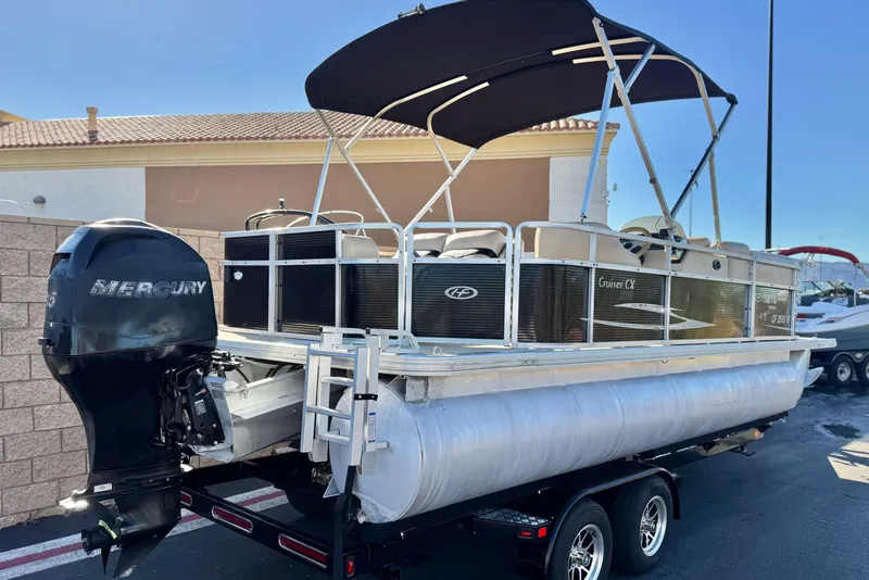 Slide: The Image of 2011 Harris Cruiser 220 CX pontoon boat with Mercury outboard motor on trailer. - 6