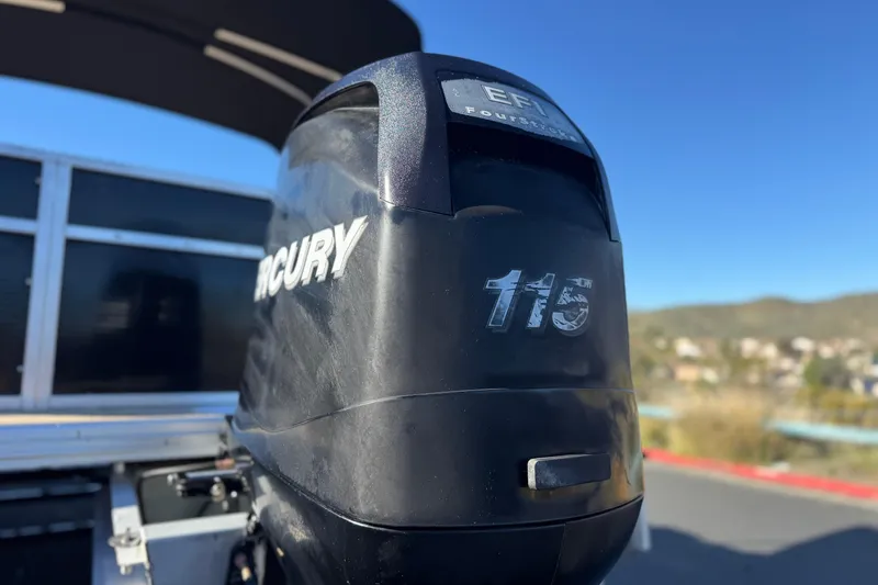 Slide: The Image of 2011 Harris Cruiser 220 CX with Mercury 115 outboard motor, sunny day background. - 8