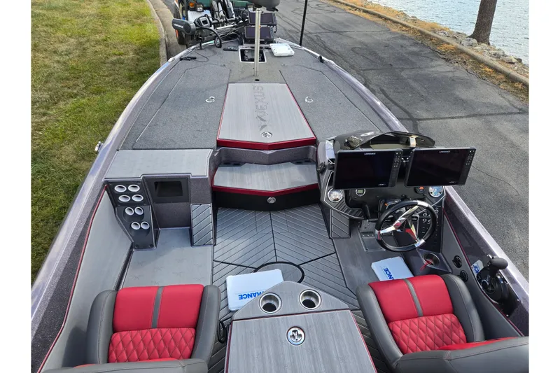 Slide: The Image of 2022 Vexus VX20 boat interior with dual screens, red seats, and sleek design. - 11