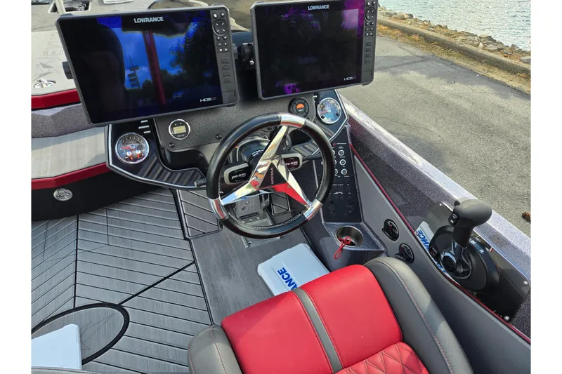 Slide: The Image of 2022 Vexus VX20 boat cockpit with dual Lowrance displays and modern steering controls. - 12